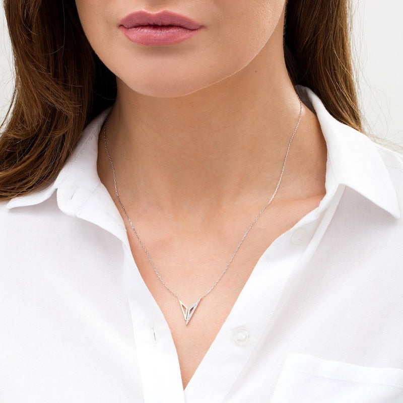 1/10 CT. T.W. Diamond &amp;quot;Bracelets of Submission&amp;quot; Necklace in Sterling Silver and 10K Gold